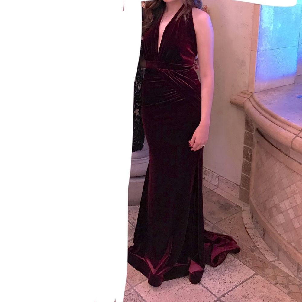 Burgundy velour gown with plunged neck detail.